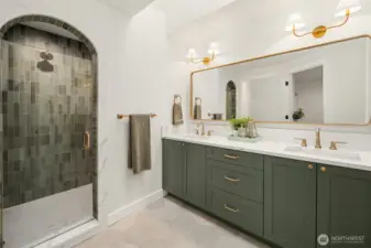Gorgeous arched shower with rich tile work