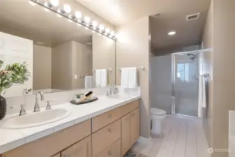 Pamper yourself in the ensuite bathroom, which boasts a soaking tub and dual vanities.