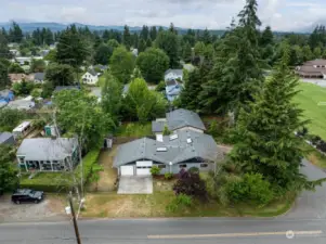 Plenty of off-street parking, and tucked behind mature cedar and deciduous trees, this home offers classic rambler 1-story flexibility with amazing options in the tall garage space for a home shop, RV or boat storage.