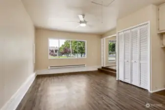 The large picture window in the family room overlooks the front yard, and the large family room has your storage needs covered with two closets including this one with louvered doors.
