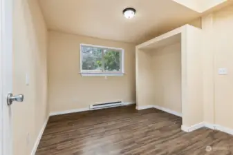 This bedroom #4 is right off of the dining room with skylight and open closet alcove that could easily be transformed into a comfortable gaming/TV center for a secondary family room space.