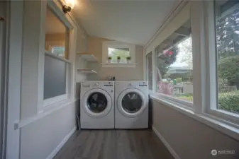 Top -full size Washer & Dryer in the sunroom.