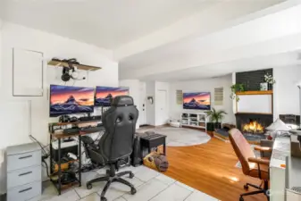 There’s ample space for two office areas as you step down into the family room (a converted garage), perfect for enjoying cozy gatherings by the fireplace.