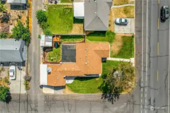 This home has a carport at the back, facing the alley, a bonus room, and a wonderful large shade tree out front!