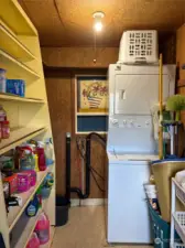 Side entry storage room with washer/dryer.