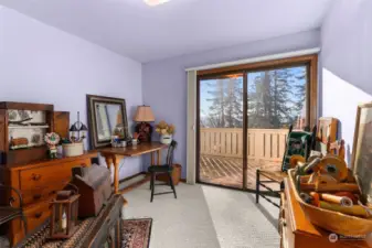 Guest Bedroom 1 with sliding doors to Deck.