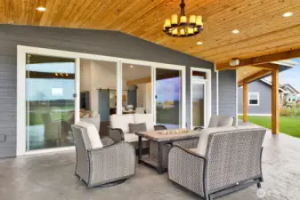 This close-up view of the patio nicely highlights the ceiling and chandelier that really add to the elegance of this outdoor living space.