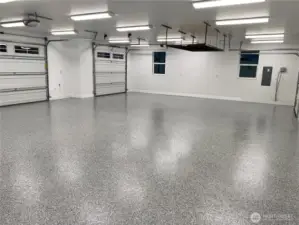 The spacious 3-car garage is equipped with extra lighting, creating the perfect environment for any home project, from weekend DIYs to serious craftsmanship.