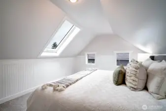East-west exposure offers dappled morning sunlight and sweet peek-a-boo sunsets. Potential for primary suite!