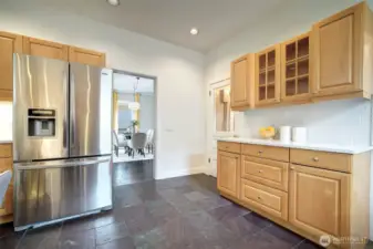 Updated kitchen, supremely functional layout, with plentiful  cupboard storage