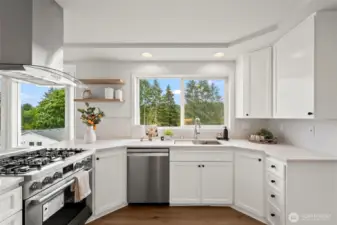 Beautiful white kitchen with quartz countertops , new cabinets and appliances.