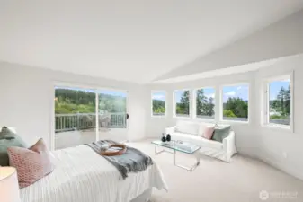 Primary bedroom with lots of light and beautiful windows.