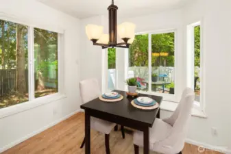 Lovely breakfast nook surrounded by windows.