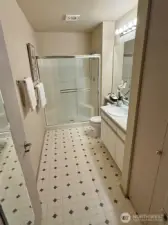 Master bath has extra large shower with glass doors