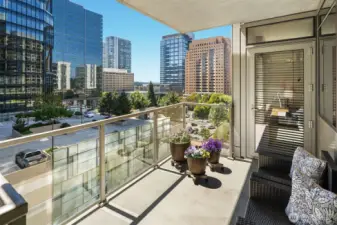 The balcony can be accessed from the dining room as well as the Primary Bedroom. This view is looking west.