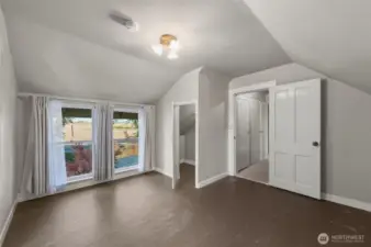 Great bonus space upstairs with views looking east.  Door on right leads to the stairs, bedroom and unfinished half bathroom.