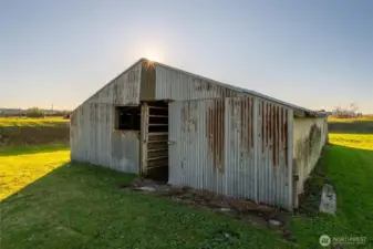 Barn in the back next to the river is grandfathered in to stay so you may update or improve it to fit your needs but if torn down, no structures are now allowed to be built within 200'ft of the river.