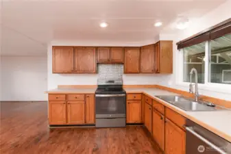 Kitchen view emphasizing storage and workflow
