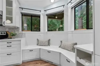Built-in bench seating in kitchen nook with storage drawers
