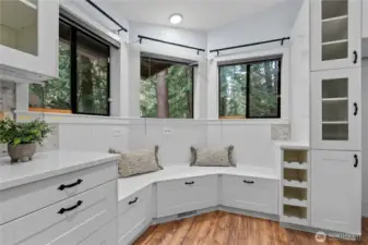 Kitchen nook with wraparound windows and built-in seating