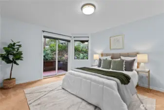 Primary bedroom with sliding glass door, and exterior access