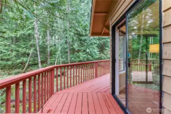 Enjoy the peace and quiet of the wooded surroundings from your wrap around deck