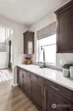 Butler's Pantry connects Kitchen & Dining. Across is a large walk-in pantry (not shown). Photos are for representational purposes only.  Colors and options may vary.