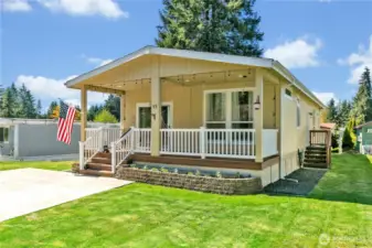 Fabulous covered porch is delightful in for all year round outdoor space.