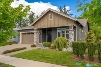 Statuesque street appeal with stone pillars and a wide front porch welcome you to this beautiful 3 bedroom home situated on a premier lot a short walk to the Seven Summits Lodge, Pickleball, Post & Pour Bistro & all amenities.