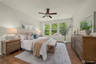 Generous primary bedroom overlooks your private backyard sanctuary.   Top down/bottom-up custom blinds with blackout shades.