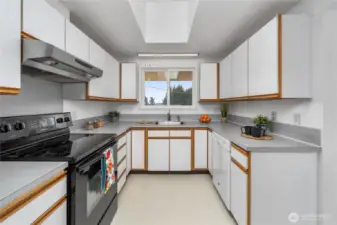This entrance to the kitchen comes straight from the front door. The dining area is to the immediate right.