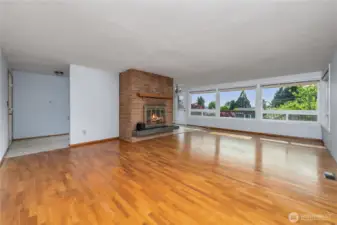 Showing the flow of the room - front door is on the left, dining room on the right side of the fireplace.