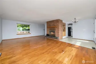 Separate dining area includes a built-in cabinet and access to the back deck.