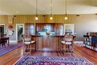 Thoughtfully designed kitchen with a large center island and bar seating—perfect for casual breakfasts, impromptu chats, or keeping the cook company.