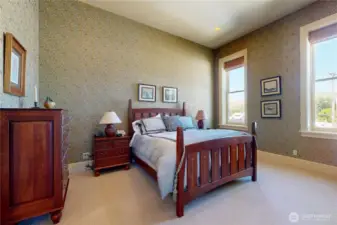 Guest bedroom – ample space, tall ceilings, and plenty of windows for natural light with beautiful views of the hills.