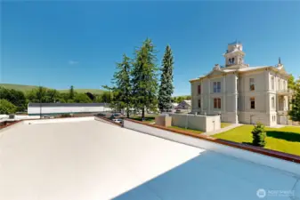 Rooftop views stretch across the historic courthouse and the rolling hills beyond—an ideal spot to pause, reflect, or simply take it all in.