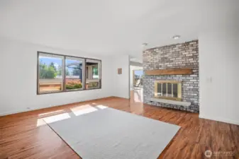 Upon entry on the left side there is a great flexible space with a wood burning fireplace