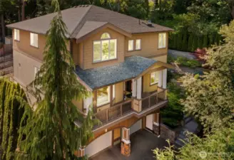 Perched high in a private enclave, this custom two-story oasis with daylight basement offers soothing views and seamless outdoor living with luxurious modern comforts. Zoned for the highly sought-after Newport High School in the Bellevue School District!