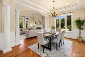 Flawless floor plan with 10' coffered ceilings, grand tiled entry, exquisite columns, crown moldings and wainscoting throughout office, formal living and dining rooms. Beautiful formal dining room showcases stately columns and arched openings.