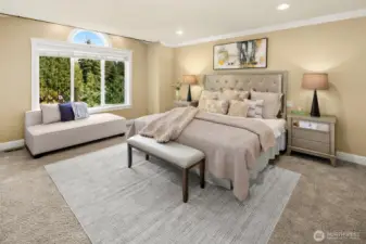 Master suite with spa bath features an extra-large jetted tub and tiled  shower, heated travertine floor, two skylights, two walk-in closets, and soothing territorial views through picture windows.