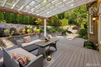 Expansive covered Trex deck in a private, secluded setting, over looking to beautiful terraced lush garden.