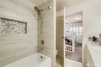 Updated tile surround and bath/shower