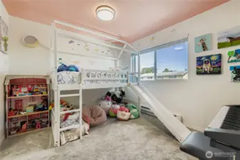 Secondary bedroom features updated windows and blinds