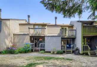 Back of the home featuring two private decks