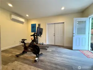 Double doors lead to shop. About 250 sq feet work great as a gym, gaming/media room, or business/office space