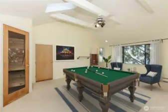 Bonus Room with sauna in corner, and water views.  Wooden door is access to storage attic space. - Virtually staged