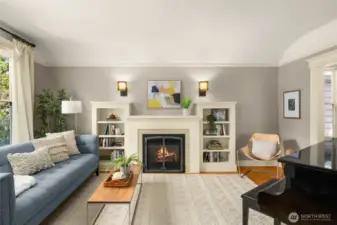 Spacious living room with high ceilings, cozy gas fireplace and quality built-ins.