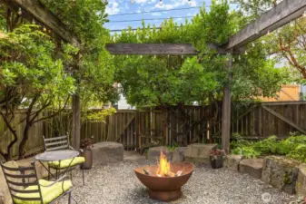 The backyard is a real oasis with lush landscaping, firepit, lighting, water feature and more.  It's an amazing getaway