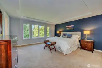 Generous primary suite with golf course views.