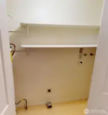 on the way to the upstairs is the "utility room" closet with washer dryer hook ups, the water heater is tucked away in here too